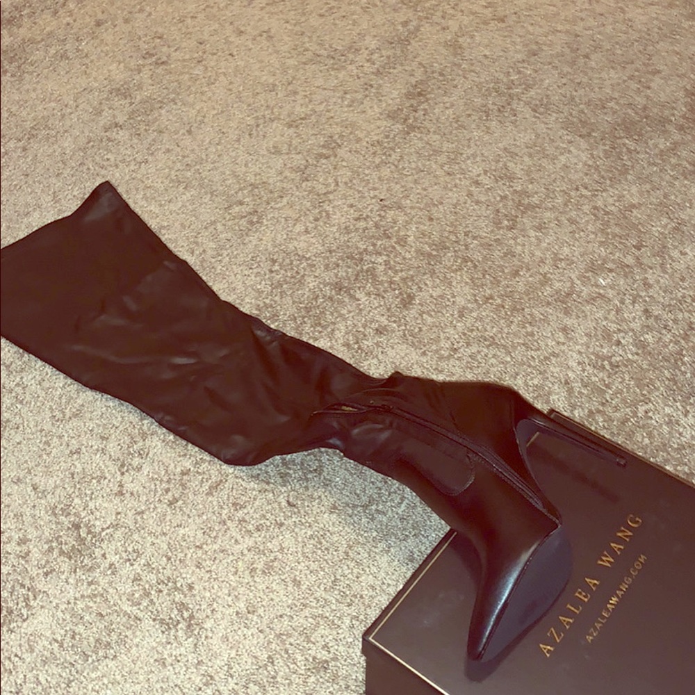 Thigh high black high heel boot